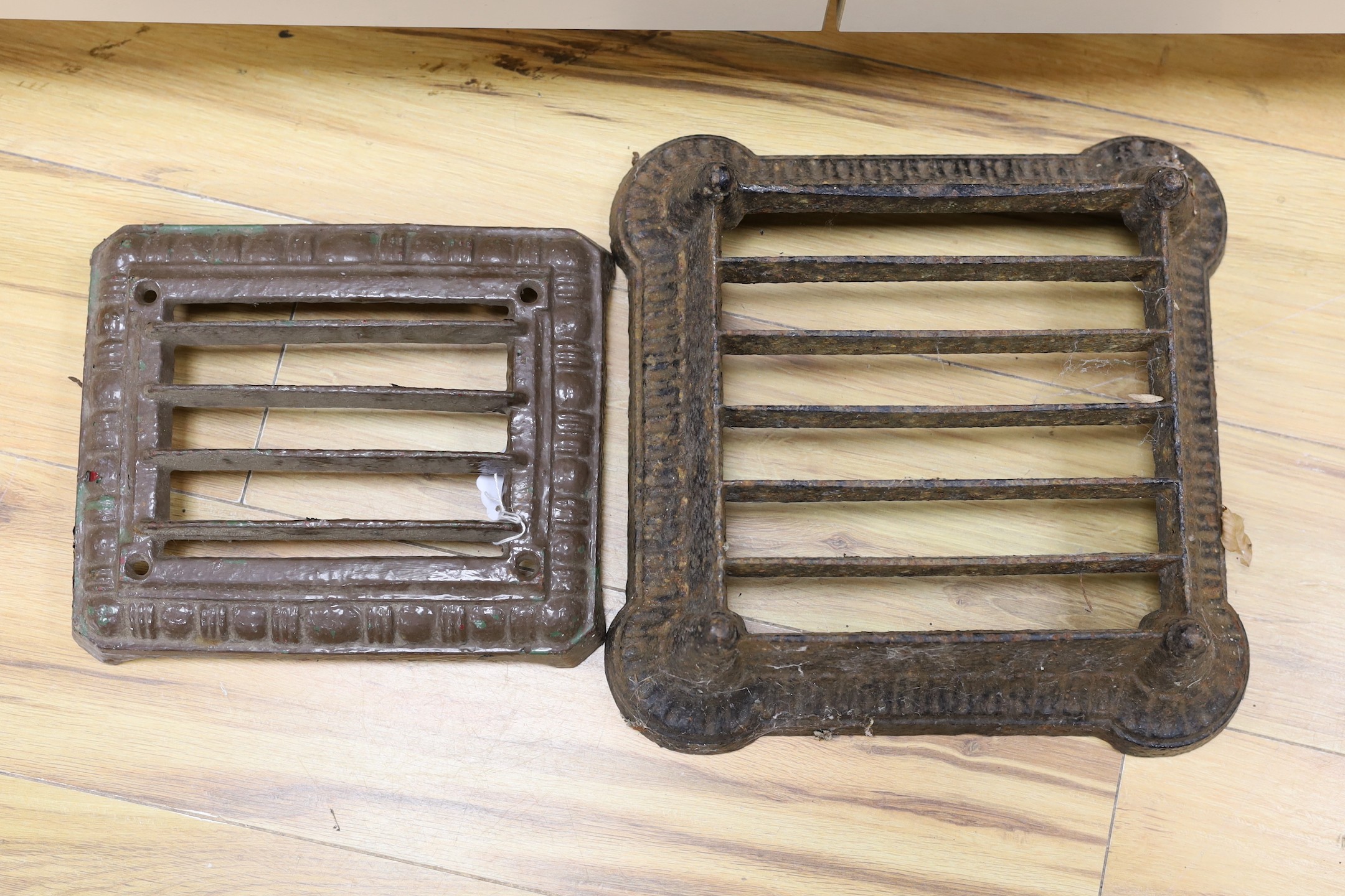 Two cast iron grille boot scrapers